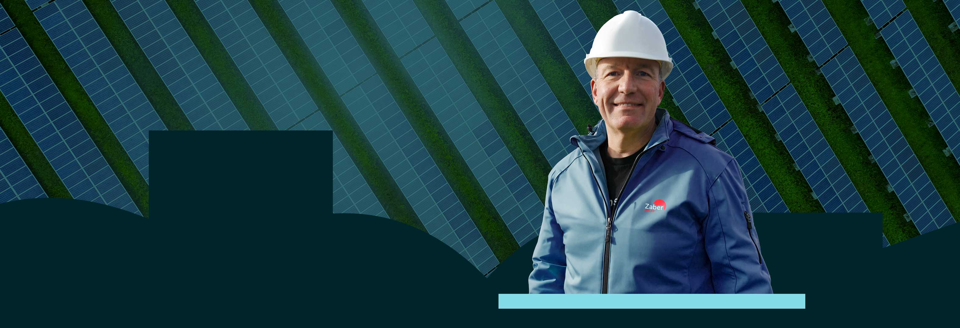 Matthias Hamann mit ZaberSolar Jacke und Helm guckt in die Kamera.